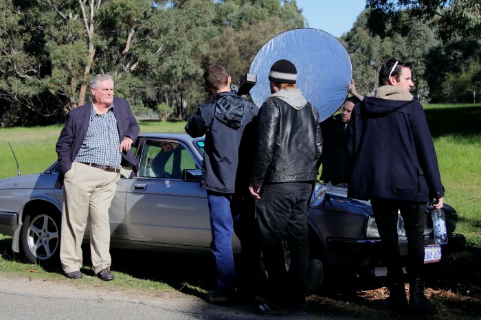 Cast and crew on set with John Howard
